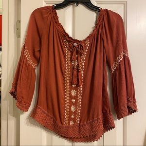 Off the shoulder red clay colored top